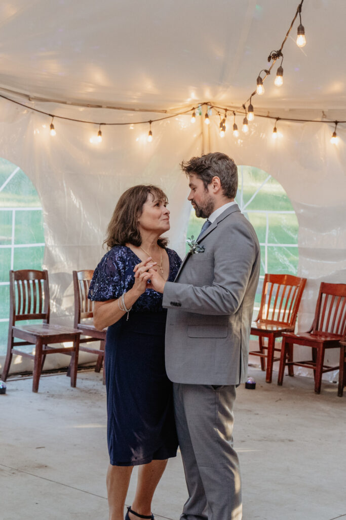 groom first dance with mother at tent wedding reception